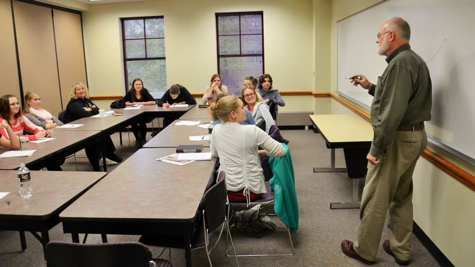 David Jauss leads area high school students through a fiction writing exercise.